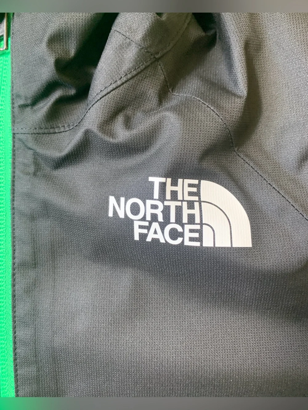 The North Face Black Hooded Jacket with Green Lining & Pink Zippers